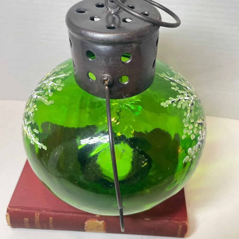 Hand-Painted Green Glass Lantern With Tree Design And Rustic Metal Top